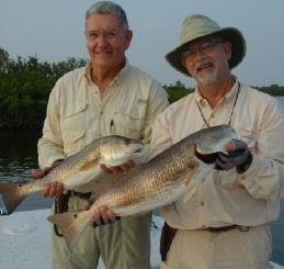 David Patten and Guy Neff are pictured with the end result of a redfish double header.